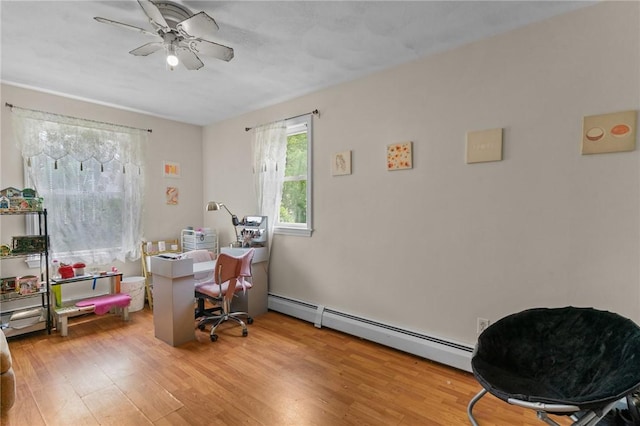 16 Spectacle Ave, Warwick, RI 02888 - office space featuring wood finished floors, baseboard heating, and a ceiling fan