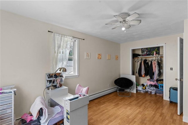 16 Spectacle Ave, Warwick, RI 02888 - home office with a baseboard heating unit, a ceiling fan, and light wood finished floors