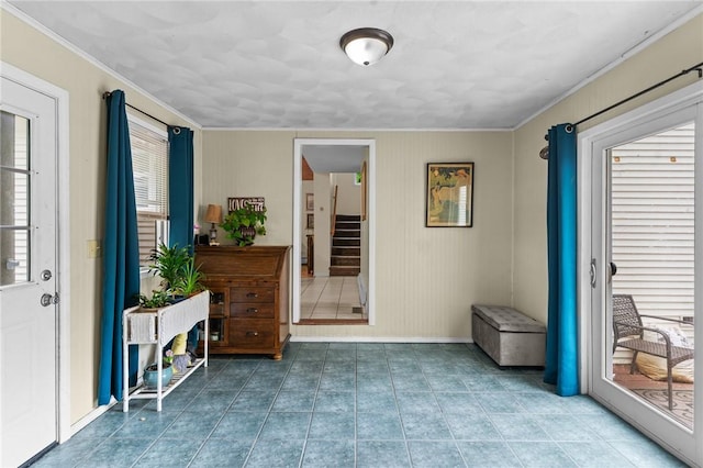 16 Spectacle Ave, Warwick, RI 02888 - foyer with ornamental molding, baseboards, stairs, and tile patterned flooring