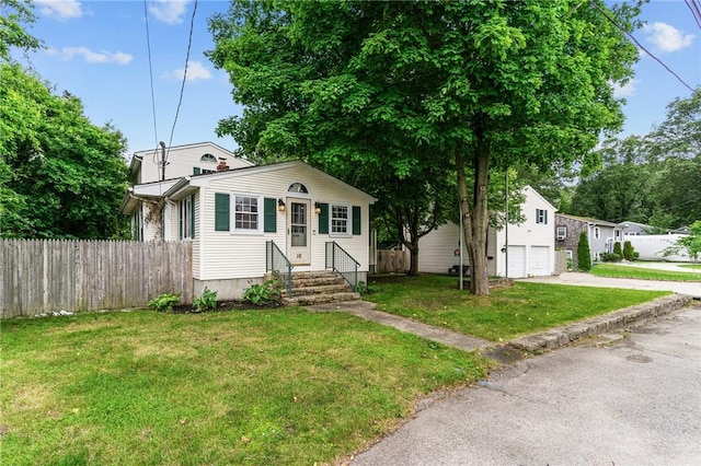 16 Spectacle Ave, Warwick, RI 02888 - bungalow featuring concrete driveway and an attached garage