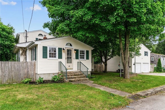 16 Spectacle Ave, Warwick, RI 02888 - view of front of home with an attached garage, entry steps, and driveway