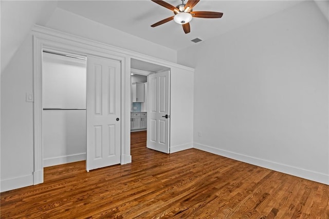 18 State St Unit 3E, Bristol, RI 02809 - unfurnished bedroom featuring baseboards, wood finished floors, a closet, and a ceiling fan