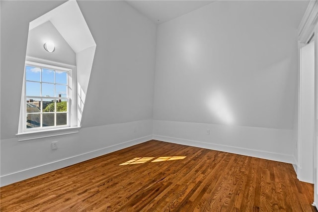 18 State St Unit 3E, Bristol, RI 02809 - unfurnished room featuring wood finished floors, baseboards, and vaulted ceiling