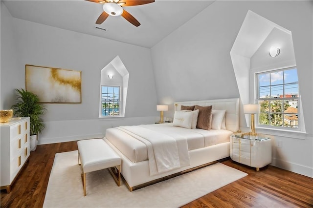 18 State St Unit 3E, Bristol, RI 02809 - bedroom with multiple windows, lofted ceiling, dark wood finished floors, and baseboards
