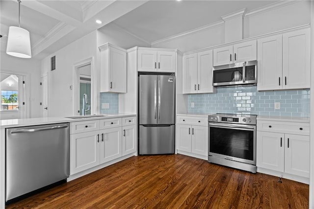 18 State St Unit 3E, Bristol, RI 02809 - kitchen with stainless steel appliances, a sink, light countertops, white cabinetry, and dark wood finished floors