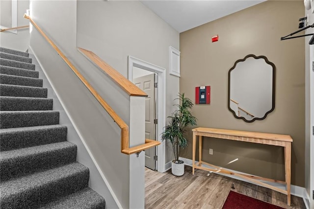 18 State St Unit 3E, Bristol, RI 02809 - staircase featuring wood finished floors and baseboards