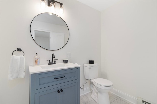 126 Weaver Hill Rd, West Greenwich, RI 02817 - bathroom with baseboard heating, baseboards, vanity, and toilet