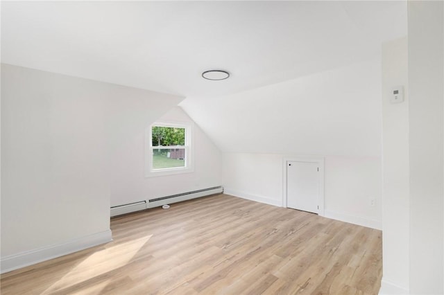 126 Weaver Hill Rd, West Greenwich, RI 02817 - bonus room with baseboard heating, light wood-style floors, lofted ceiling, and baseboards