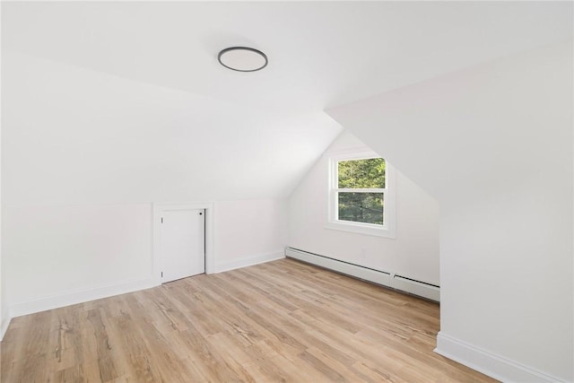 126 Weaver Hill Rd, West Greenwich, RI 02817 - bonus room with baseboard heating, light wood finished floors, baseboards, and vaulted ceiling