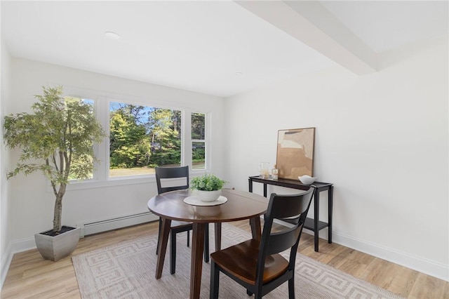 126 Weaver Hill Rd, West Greenwich, RI 02817 - dining space featuring a baseboard radiator, light wood-type flooring, and baseboards