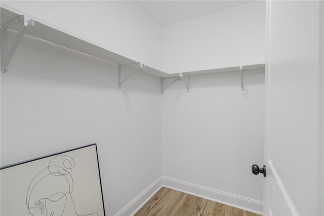 126 Weaver Hill Rd, West Greenwich, RI 02817 - walk in closet with light wood-style flooring