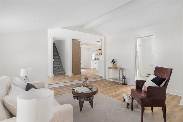 126 Weaver Hill Rd, West Greenwich, RI 02817 - living room featuring light wood-type flooring, stairs, baseboards, and a baseboard radiator