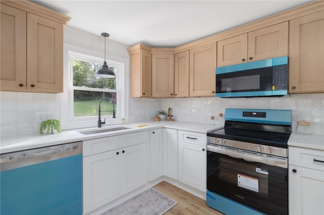 126 Weaver Hill Rd, West Greenwich, RI 02817 - kitchen with appliances with stainless steel finishes, a sink, light countertops, and backsplash