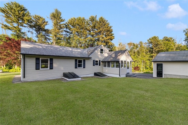 126 Weaver Hill Rd, West Greenwich, RI 02817 - rear view of house featuring a lawn