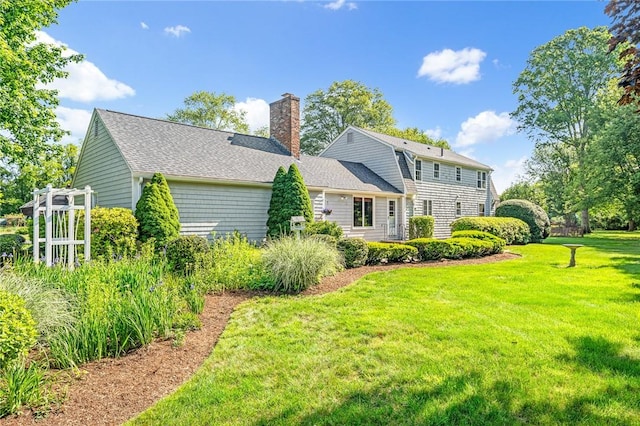 11 Crosswynds Dr, Narragansett, RI 02874 - rear view of property with a chimney, a yard, and a shingled roof