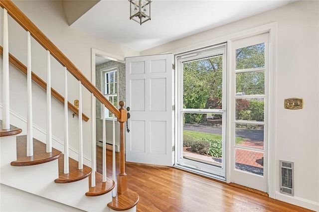 11 Crosswynds Dr, Narragansett, RI 02874 - entrance foyer with stairway, wood finished floors, heating unit, and a baseboard radiator