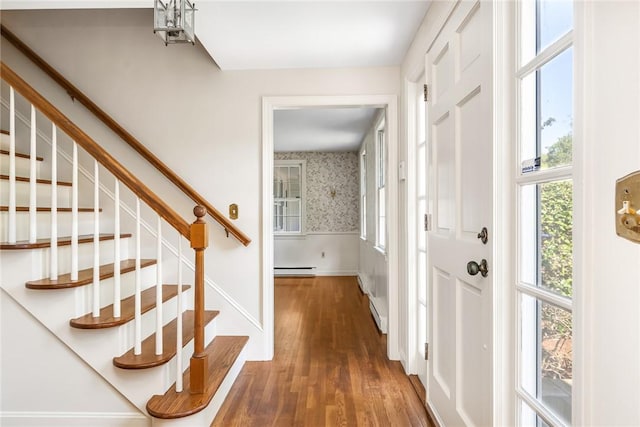 11 Crosswynds Dr, Narragansett, RI 02874 - foyer entrance with wood finished floors, stairway, a baseboard radiator, baseboards, and wallpapered walls