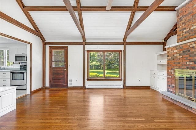 11 Crosswynds Dr, Narragansett, RI 02874 - unfurnished living room featuring wood finished floors, baseboards, plenty of natural light, and a baseboard radiator