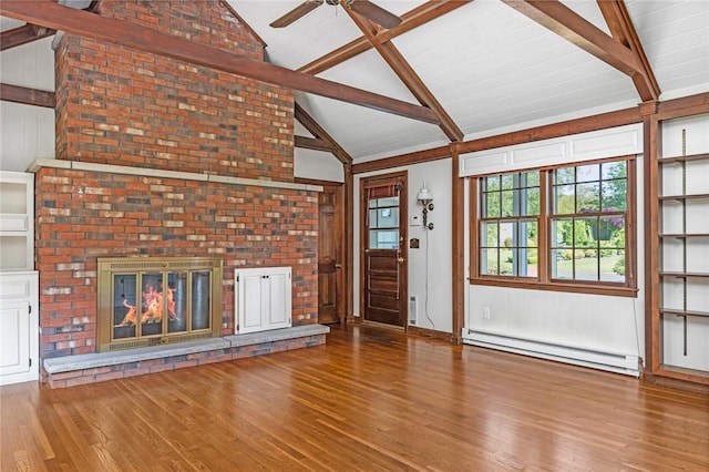 11 Crosswynds Dr, Narragansett, RI 02874 - unfurnished living room with a baseboard heating unit, wood finished floors, a ceiling fan, a brick fireplace, and wooden walls