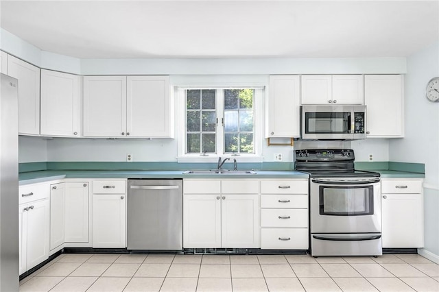 11 Crosswynds Dr, Narragansett, RI 02874 - kitchen with stainless steel appliances, a sink, white cabinets, and light countertops