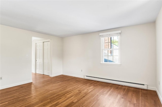 11 Crosswynds Dr, Narragansett, RI 02874 - spare room with a baseboard heating unit, wood finished floors, and baseboards