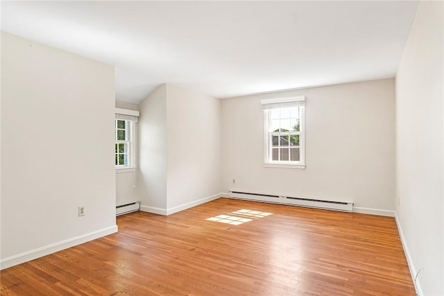 11 Crosswynds Dr, Narragansett, RI 02874 - spare room featuring baseboard heating, plenty of natural light, and light wood-type flooring