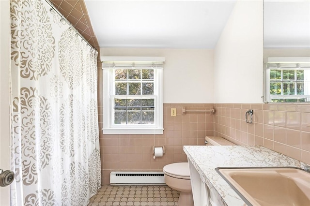 11 Crosswynds Dr, Narragansett, RI 02874 - full bathroom with baseboard heating, tile walls, toilet, vanity, and tile patterned flooring