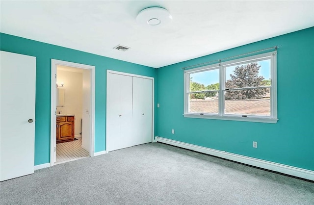 2970 Mendon Rd Unit 160, Cumberland, RI 02864 - unfurnished bedroom with a baseboard heating unit, carpet floors, a closet, baseboards, and ensuite bathroom