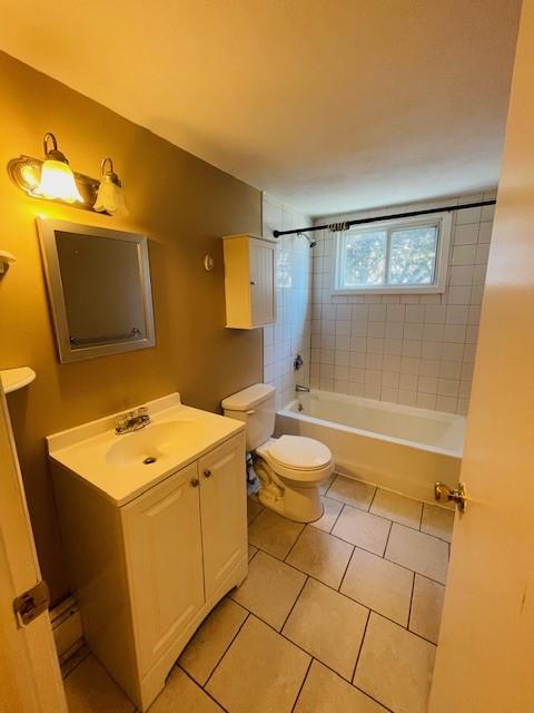 29 Woodbine St Unit 5, Pawtucket, RI 02860 - bathroom with vanity, toilet, and tile patterned floors