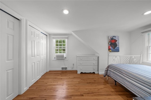 19 Woodsia Rd, Narragansett, RI 02874 - bedroom with light wood-style floors, recessed lighting, and cooling unit