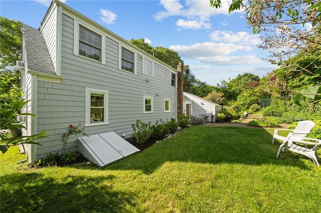 19 Woodsia Rd, Narragansett, RI 02874 - rear view of house featuring a lawn and a shingled roof