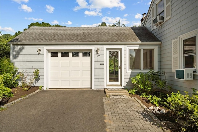 19 Woodsia Rd, Narragansett, RI 02874 - garage with driveway and cooling unit