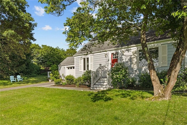 19 Woodsia Rd, Narragansett, RI 02874 - cape cod home with an attached garage, a front yard, and driveway