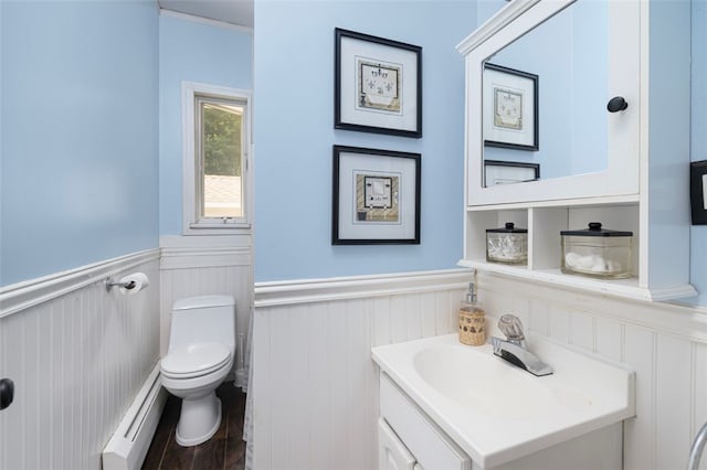30 Lincoln St, Smithfield, RI 02917 - half bathroom with a baseboard radiator, toilet, wainscoting, vanity, and wood finished floors