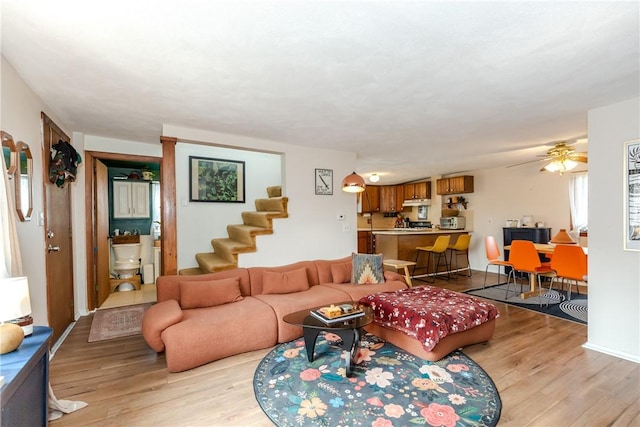 339 Beverage Hill Ave, Pawtucket, RI 02861 - living room with light wood-style floors and stairway