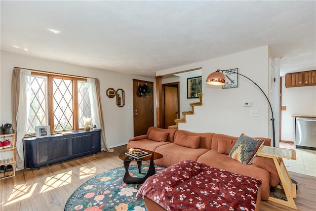 339 Beverage Hill Ave, Pawtucket, RI 02861 - living room featuring light wood finished floors, stairs, and baseboards