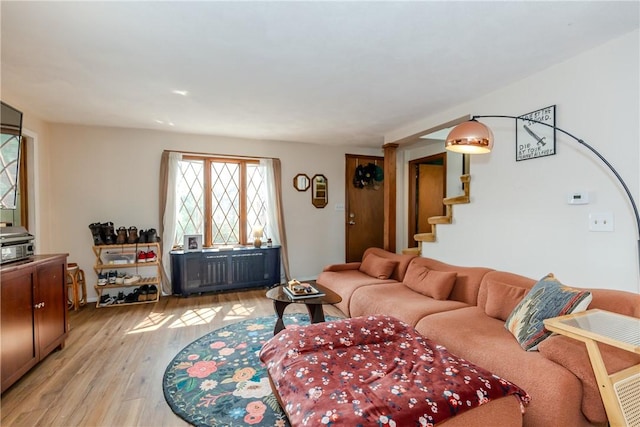 339 Beverage Hill Ave, Pawtucket, RI 02861 - living room with light wood-style floors and stairway