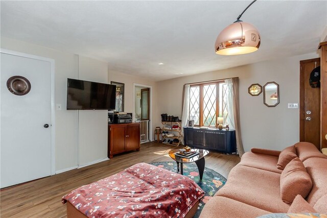 339 Beverage Hill Ave, Pawtucket, RI 02861 - living room with wood finished floors and radiator heating unit