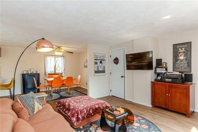 339 Beverage Hill Ave, Pawtucket, RI 02861 - living room with light wood-style floors, a ceiling fan, and baseboards