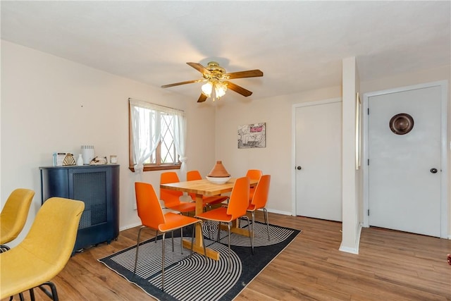 339 Beverage Hill Ave, Pawtucket, RI 02861 - dining area with wood finished floors, a ceiling fan, and baseboards