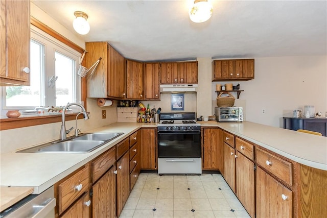 339 Beverage Hill Ave, Pawtucket, RI 02861 - kitchen featuring white range with gas stovetop, under cabinet range hood, a sink, a peninsula, and light countertops
