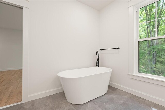 66 Orchard Ave, Johnston, RI 02919 - full bath with a freestanding tub and plenty of natural light