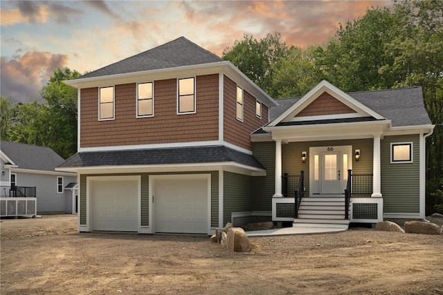 66 Orchard Ave, Johnston, RI 02919 - view of front of home with a garage, driveway, a shingled roof, and covered porch