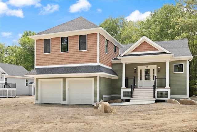 66 Orchard Ave, Johnston, RI 02919 - view of front facade featuring a shingled roof, a garage, driveway, and a porch