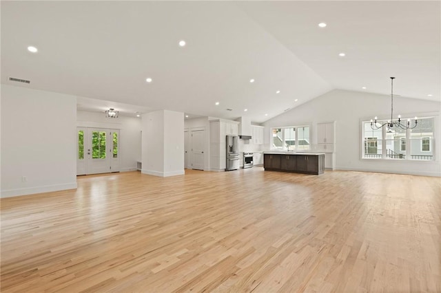 66 Orchard Ave, Johnston, RI 02919 - unfurnished living room featuring a chandelier, light wood-style flooring, recessed lighting, and high vaulted ceiling