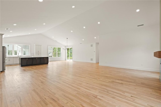 66 Orchard Ave, Johnston, RI 02919 - unfurnished living room with light wood-type flooring, recessed lighting, and high vaulted ceiling