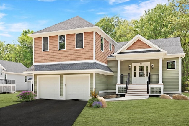 66 Orchard Ave, Johnston, RI 02919 - view of front of house with roof with shingles, driveway, a front lawn, and an attached garage