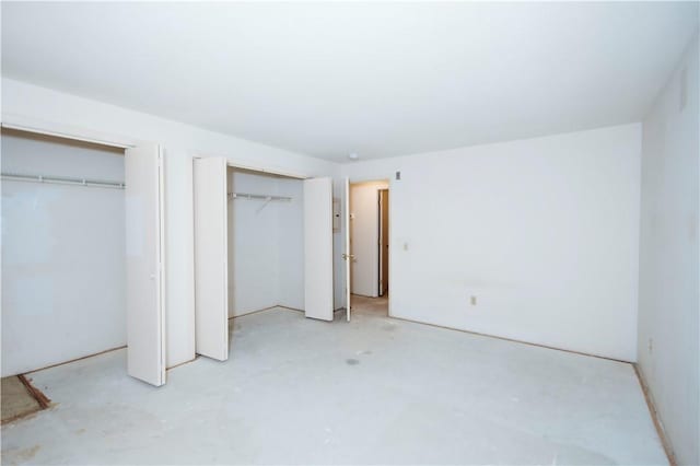 66 Girard Ave Unit 106, Newport, RI 02840 - unfurnished bedroom with multiple closets and concrete flooring