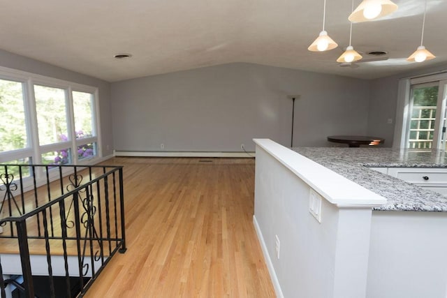 38 Williams Rd, Smithfield, RI 02917 - hallway featuring light wood-style flooring, lofted ceiling, an upstairs landing, baseboards, and baseboard heating