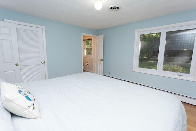 38 Williams Rd, Smithfield, RI 02917 - bedroom featuring a baseboard radiator and a closet